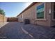 Landscaped backyard with gravel and a brick patio area at 20226 N 260Th Dr, Buckeye, AZ 85396