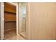 Bathroom with shower and walk-in closet access at 20226 N 260Th Dr, Buckeye, AZ 85396