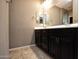 Bathroom with double vanity and dark brown cabinets at 20226 N 260Th Dr, Buckeye, AZ 85396