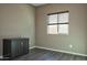 Simple bedroom with window, blinds and dark wood flooring at 20226 N 260Th Dr, Buckeye, AZ 85396