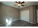 Well-lit bedroom with ceiling fan and double door closet at 20226 N 260Th Dr, Buckeye, AZ 85396
