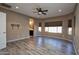 Bright bedroom with wood-look floors and ensuite bathroom at 20226 N 260Th Dr, Buckeye, AZ 85396