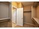 Bright walk-in closet with access to bathroom at 20226 N 260Th Dr, Buckeye, AZ 85396