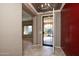 Bright entryway with tile floors and a modern chandelier at 20226 N 260Th Dr, Buckeye, AZ 85396
