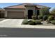 Single-story house with a two-car garage and well-manicured landscaping at 20226 N 260Th Dr, Buckeye, AZ 85396