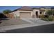 Single story home with a two-car garage and desert landscaping at 20226 N 260Th Dr, Buckeye, AZ 85396