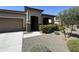 One-story home with attached garage and neatly landscaped front yard at 20226 N 260Th Dr, Buckeye, AZ 85396