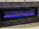 Close-up view of a modern linear electric fireplace at 20226 N 260Th Dr, Buckeye, AZ 85396