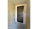 Front entryway with a security door and neutral colored walls at 20226 N 260Th Dr, Buckeye, AZ 85396