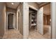 Hallway with linen closet and view into another room at 20226 N 260Th Dr, Buckeye, AZ 85396