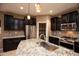 Updated kitchen boasts stainless steel sink and appliances, along with granite countertops at 20226 N 260Th Dr, Buckeye, AZ 85396