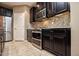 Bright kitchen with double oven, microwave, and granite countertops at 20226 N 260Th Dr, Buckeye, AZ 85396