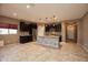 Open kitchen with dark cabinets, granite counters and island at 20226 N 260Th Dr, Buckeye, AZ 85396