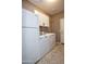 Laundry room with washer, dryer, and additional storage at 20226 N 260Th Dr, Buckeye, AZ 85396