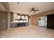 Living room with fireplace and ceiling fan at 20226 N 260Th Dr, Buckeye, AZ 85396
