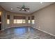 Bright living room featuring wood-look floors and large windows at 20226 N 260Th Dr, Buckeye, AZ 85396