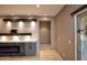 Living room with modern fireplace and built-in shelving at 20226 N 260Th Dr, Buckeye, AZ 85396