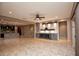 Spacious living room featuring a modern fireplace and sliding door access to the backyard at 20226 N 260Th Dr, Buckeye, AZ 85396