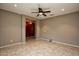 Bright living room with tile floors and a view into entryway at 20226 N 260Th Dr, Buckeye, AZ 85396