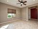 Open living room with tile floors and a view of entryway at 20226 N 260Th Dr, Buckeye, AZ 85396