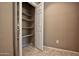 Open pantry with multiple shelves for storage at 20226 N 260Th Dr, Buckeye, AZ 85396
