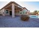 Inviting kidney-shaped pool with surrounding patio at 20226 N 260Th Dr, Buckeye, AZ 85396