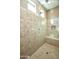 Large walk-in shower with tiled walls and built-in seat at 20226 N 260Th Dr, Buckeye, AZ 85396