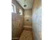 Large walk-in shower with built-in seat at 20226 N 260Th Dr, Buckeye, AZ 85396