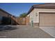 Wooden fence and gate provide privacy and access to the side yard at 20226 N 260Th Dr, Buckeye, AZ 85396