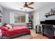 Well-lit bedroom with a full bed and ceiling fan at 2085 S Marble St, Gilbert, AZ 85295