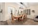 Bright dining room with a large wooden table and six chairs at 2085 S Marble St, Gilbert, AZ 85295