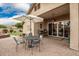 Relaxing patio with table, chairs, and umbrella at 2085 S Marble St, Gilbert, AZ 85295