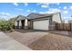 Gray house with a large driveway and a modern design at 21123 E Mayberry Rd, Queen Creek, AZ 85142