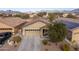 House with solar panels and a two-car garage. Mountain views at 22568 W Gardenia Dr, Buckeye, AZ 85326