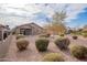Spacious backyard with gravel and mature shrubs at 22568 W Gardenia Dr, Buckeye, AZ 85326