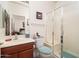 Clean bathroom with a shower, toilet, and vanity with a large mirror at 22568 W Gardenia Dr, Buckeye, AZ 85326