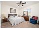 Spacious bedroom with carpeted floor, a king-size bed, and ample natural light at 22568 W Gardenia Dr, Buckeye, AZ 85326