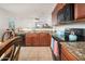 Kitchen boasting granite countertops and dark wood cabinetry at 22568 W Gardenia Dr, Buckeye, AZ 85326