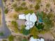 Aerial view of a unique home with a pool and landscaped desert lot at 25555 N Wrangler Rd, Scottsdale, AZ 85255