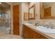 Bathroom with double sinks and a large mirror at 25555 N Wrangler Rd, Scottsdale, AZ 85255