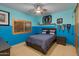 Bright bedroom with a comfy bed and blue walls at 25555 N Wrangler Rd, Scottsdale, AZ 85255