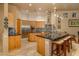 Gourmet kitchen with light wood cabinets, granite countertops, and stainless steel appliances at 25555 N Wrangler Rd, Scottsdale, AZ 85255