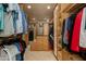 Spacious walk-in closet with ample shelving and hanging space at 25555 N Wrangler Rd, Scottsdale, AZ 85255