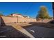 Backyard with patio, block wall, and fire pit at 25584 W Crown King Rd, Buckeye, AZ 85326