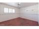 Cozy bedroom with pink carpet and window shutters at 2562 E Vermont Ave, Phoenix, AZ 85016