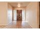 Entryway with hexagonal tile floor and ornate wood door at 2562 E Vermont Ave, Phoenix, AZ 85016