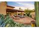 Landscaped backyard with patio furniture and desert plants at 25836 N Primo Cir, Rio Verde, AZ 85263