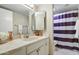 Clean bathroom with a vanity, shower, and striped curtain at 25836 N Primo Cir, Rio Verde, AZ 85263