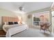 Bright bedroom featuring a king-size bed and a relaxing sitting area at 25836 N Primo Cir, Rio Verde, AZ 85263