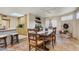 Charming dining area with rustic table and brick fireplace at 25836 N Primo Cir, Rio Verde, AZ 85263